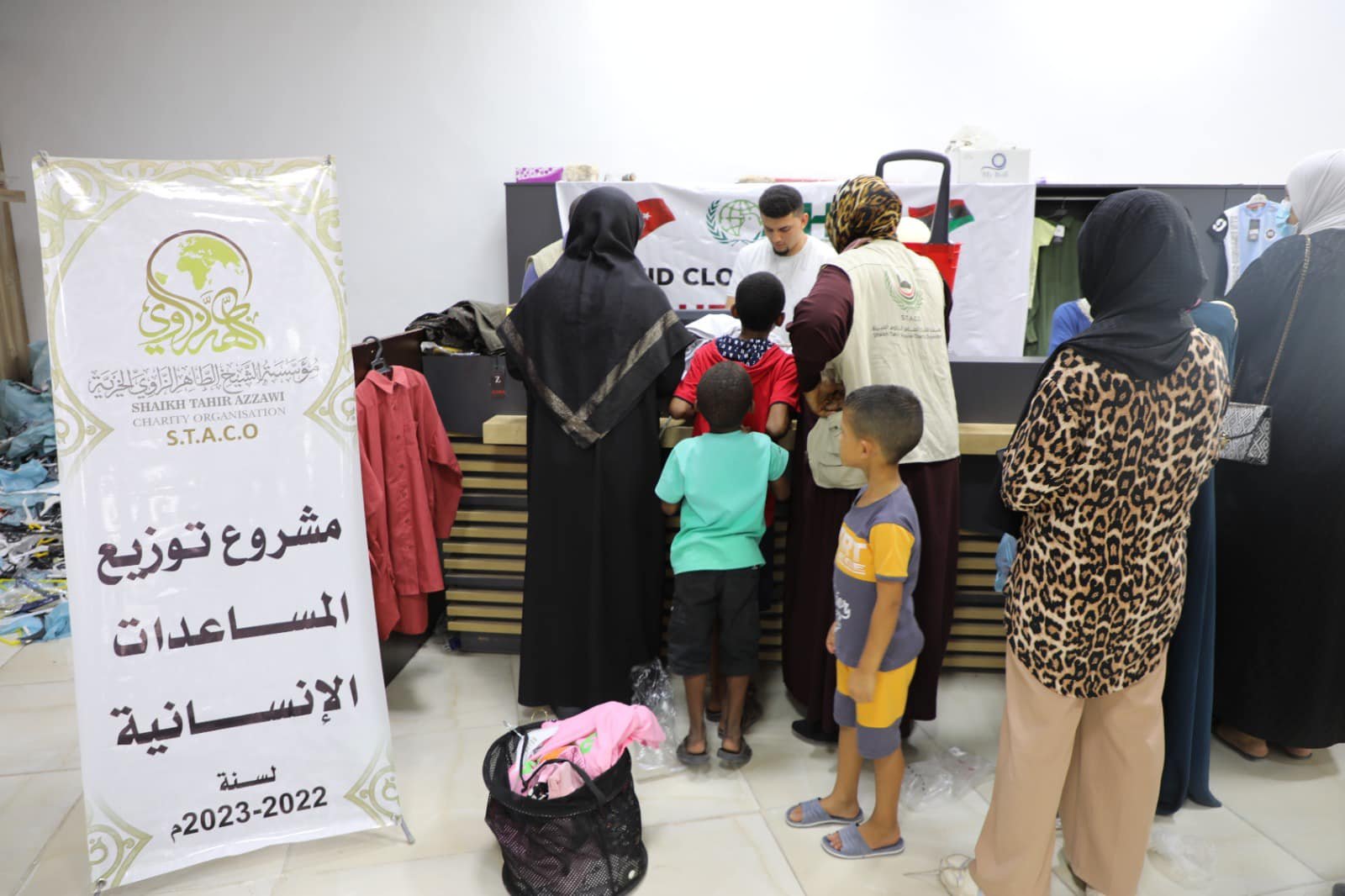 The relief team begins distributing financial aid to orphans